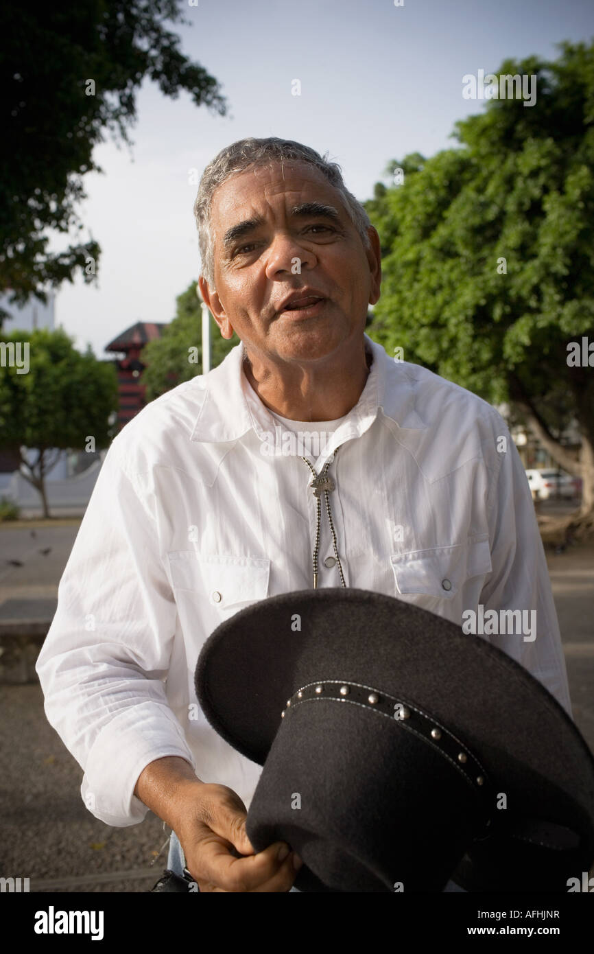 Old man holding hat hi-res stock photography and images - Alamy