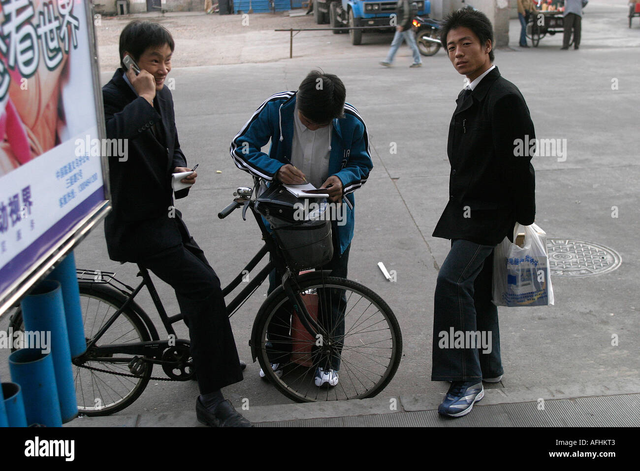 Cyclist on his mobile Stock Photo