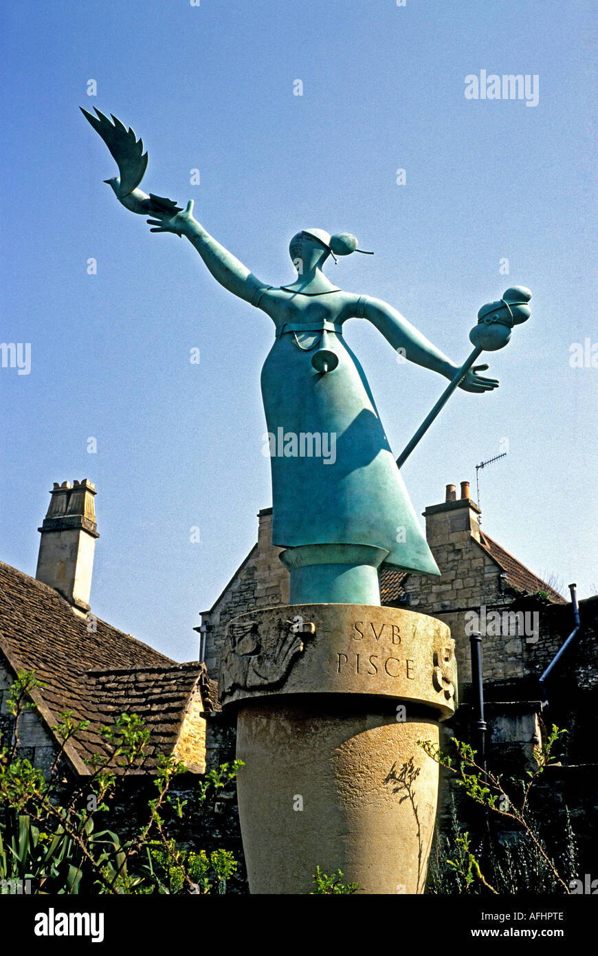 Modern Millennium statue woman with dove in a small public garden in 'Bradford on Avon' Wiltshire UK Stock Photo