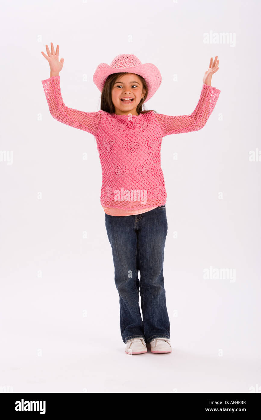 Studio portrait of young girl wearing pink cowgirl hat Stock Photo - Alamy