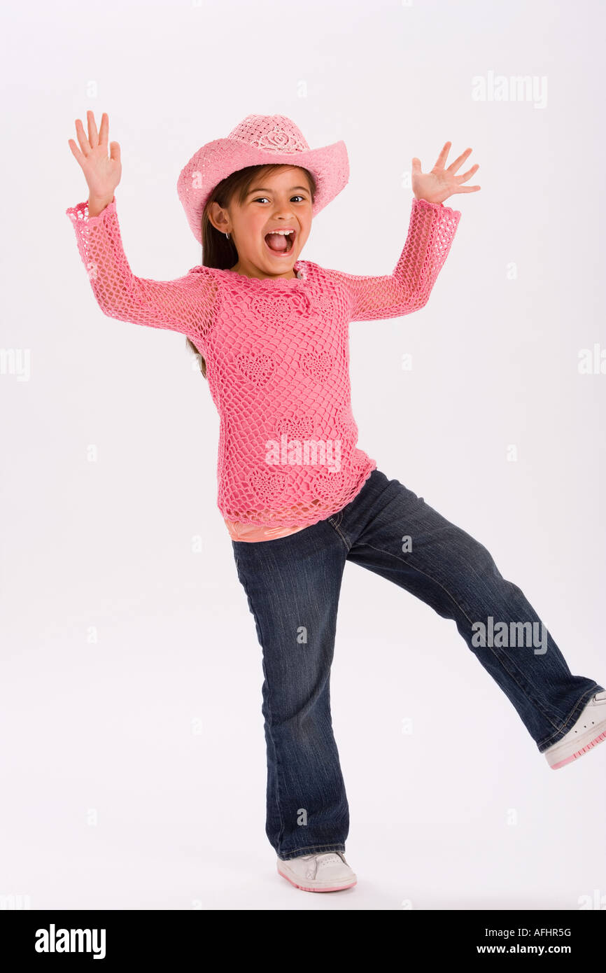 Studio portrait of young girl wearing pink cowgirl hat Stock Photo - Alamy