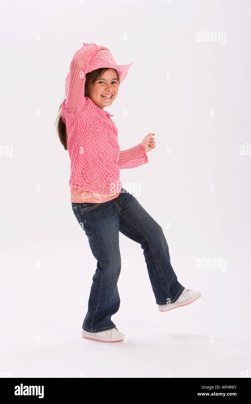 Studio portrait of young girl wearing pink cowgirl hat Stock Photo - Alamy