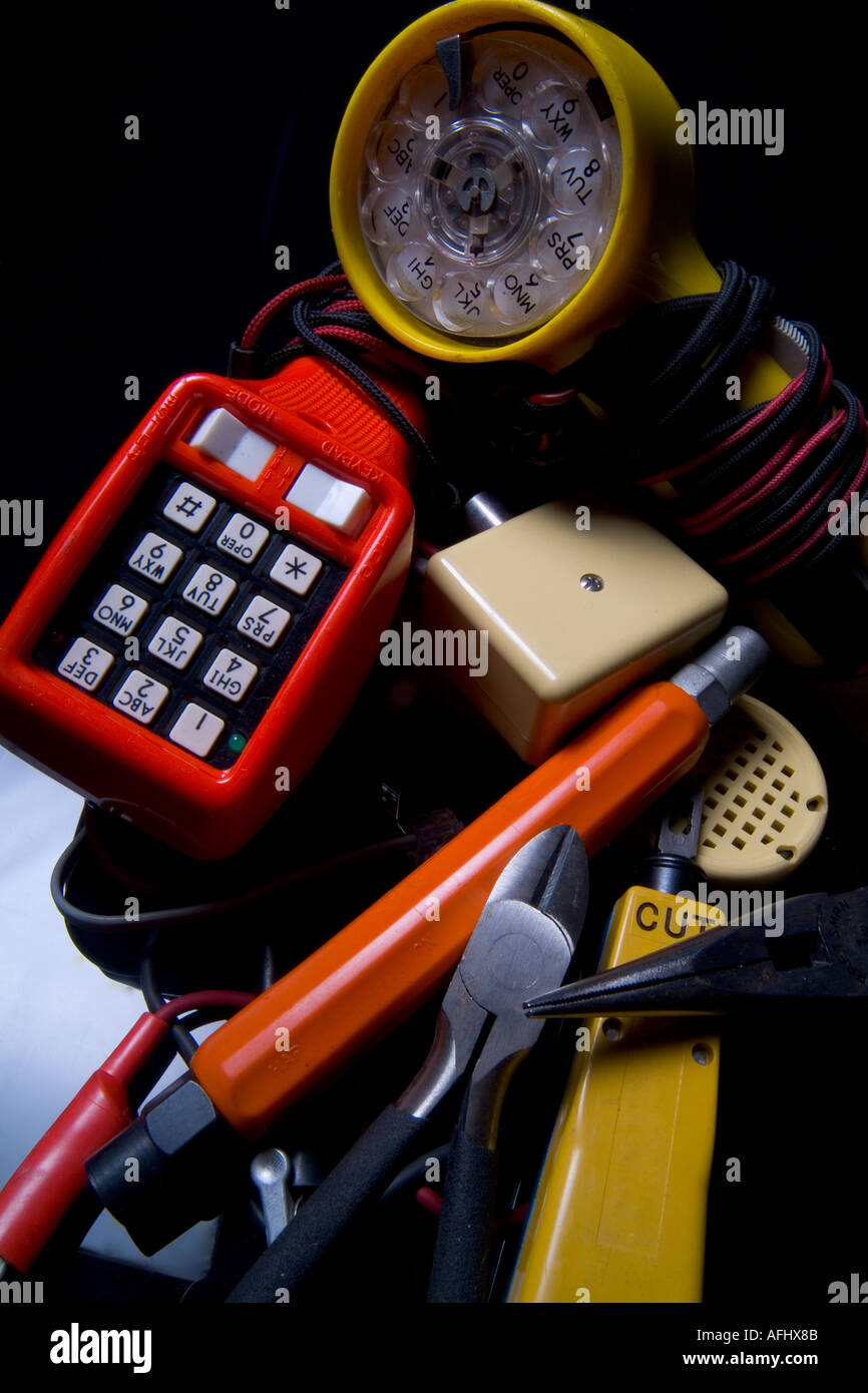 Pile of telephone repair tools on black background Stock Photo