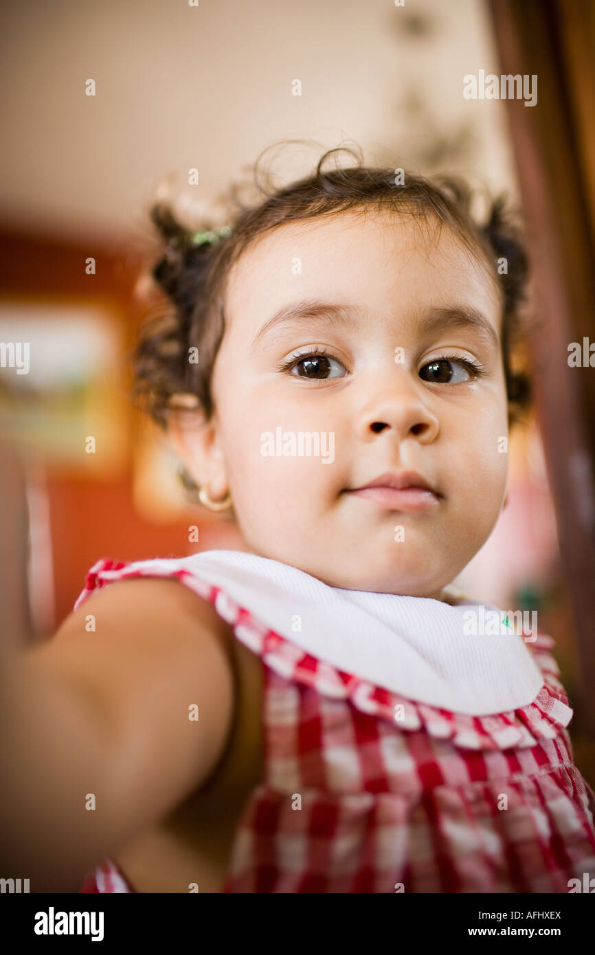 Close-up of a baby girl looking away Stock Photo - Alamy