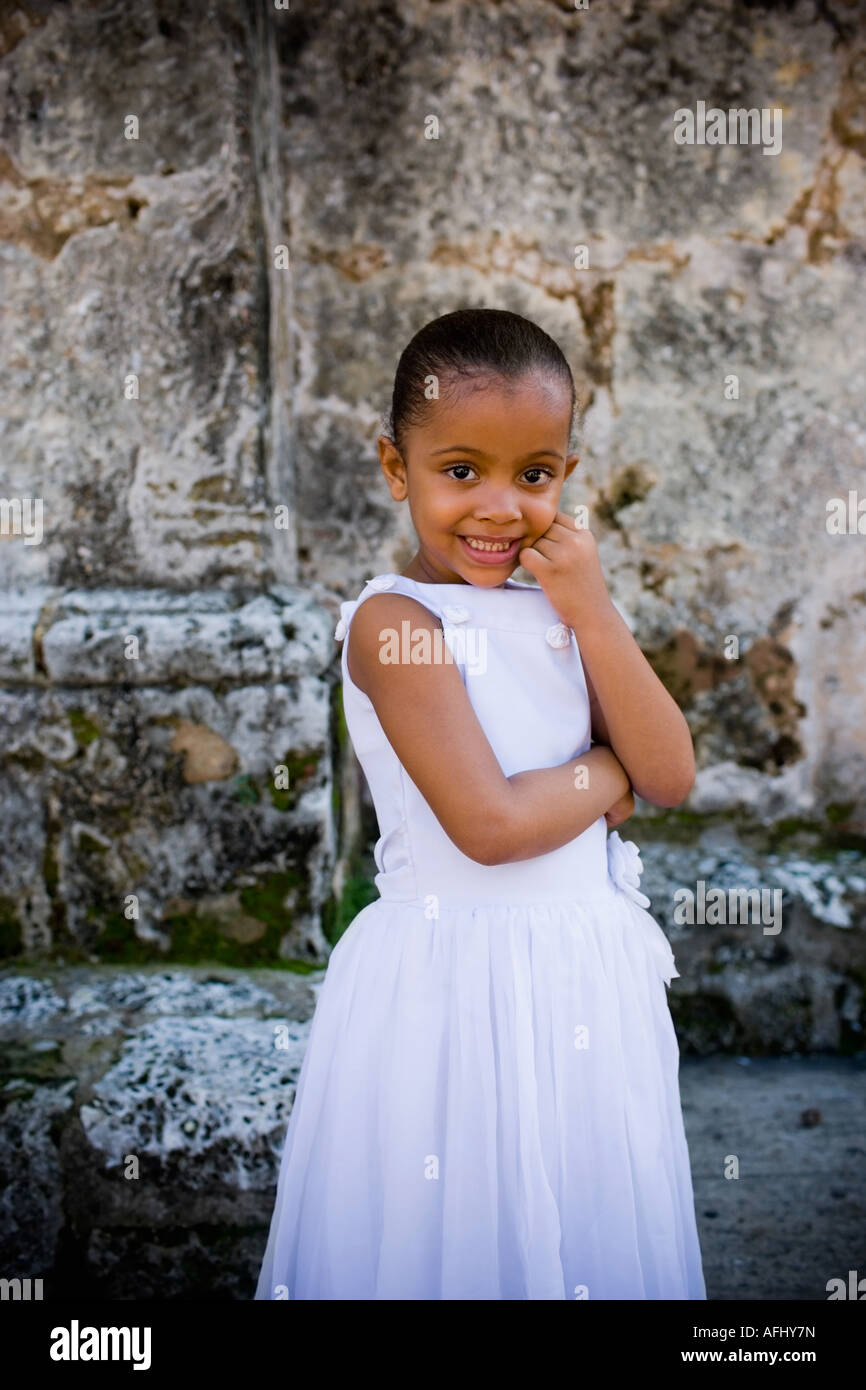 Portrait of a girl smiling with her hand on her chin Stock Photo - Alamy