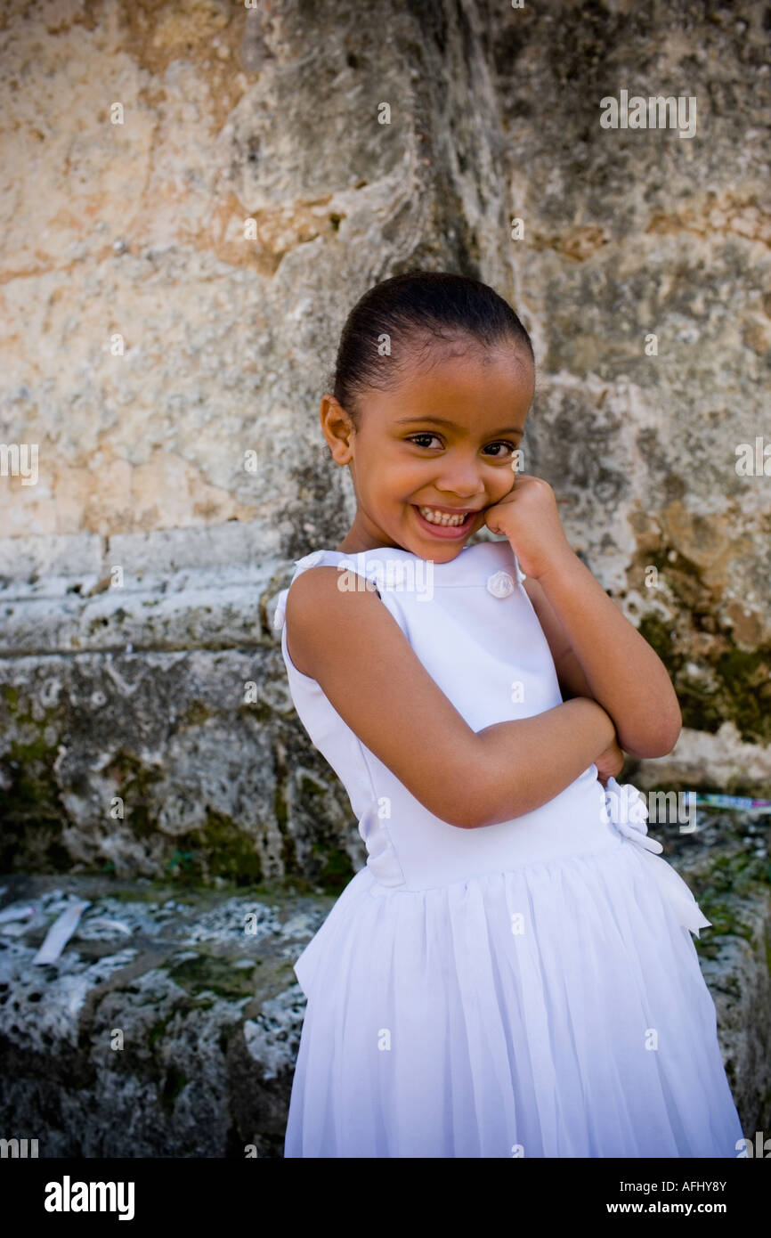 Portrait of a girl smiling with her hand on her chin Stock Photo - Alamy