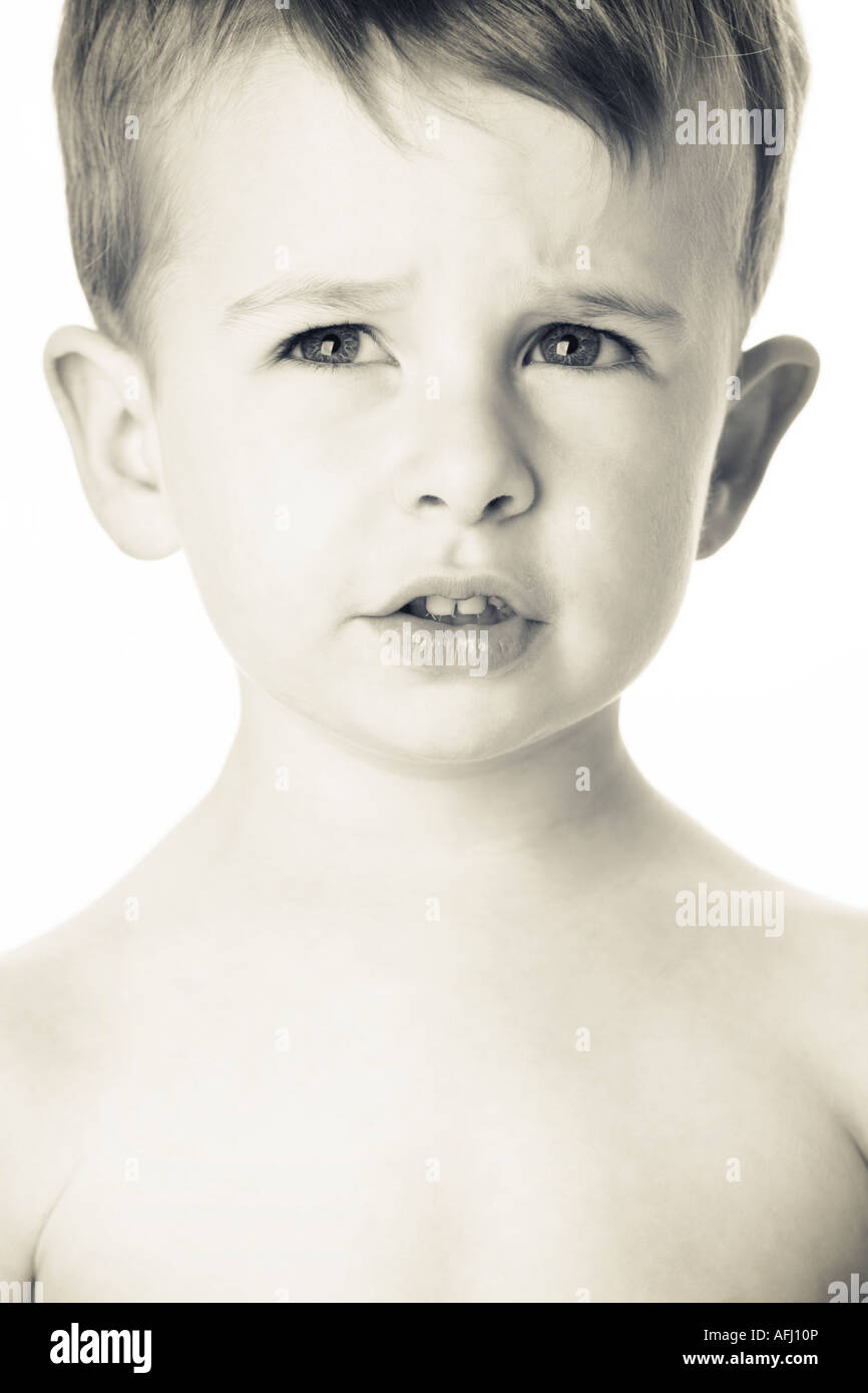 Young boy in studio black and white close up Stock Photo - Alamy