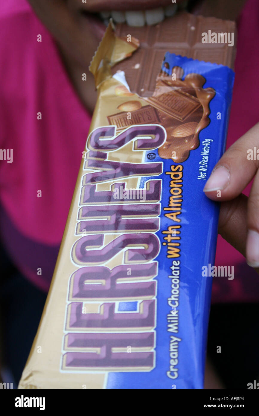 Women Eating Hersheys Chocolate Stock Photo Alamy