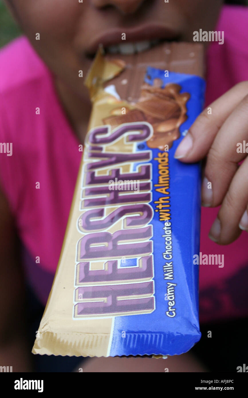 Women Eating Hersheys Chocolate Stock Photo Alamy