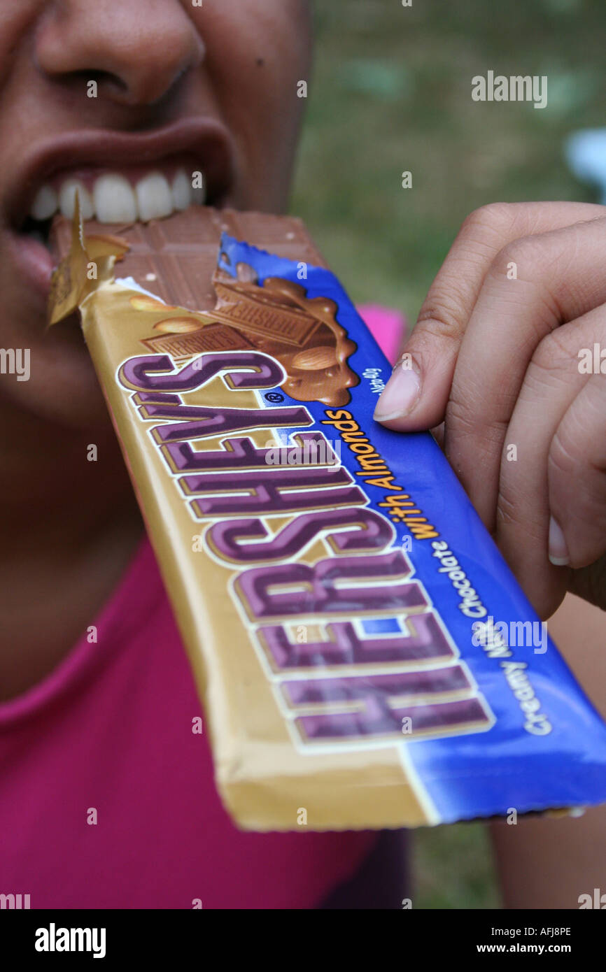 Women Eating Hersheys Chocolate Stock Photo Alamy
