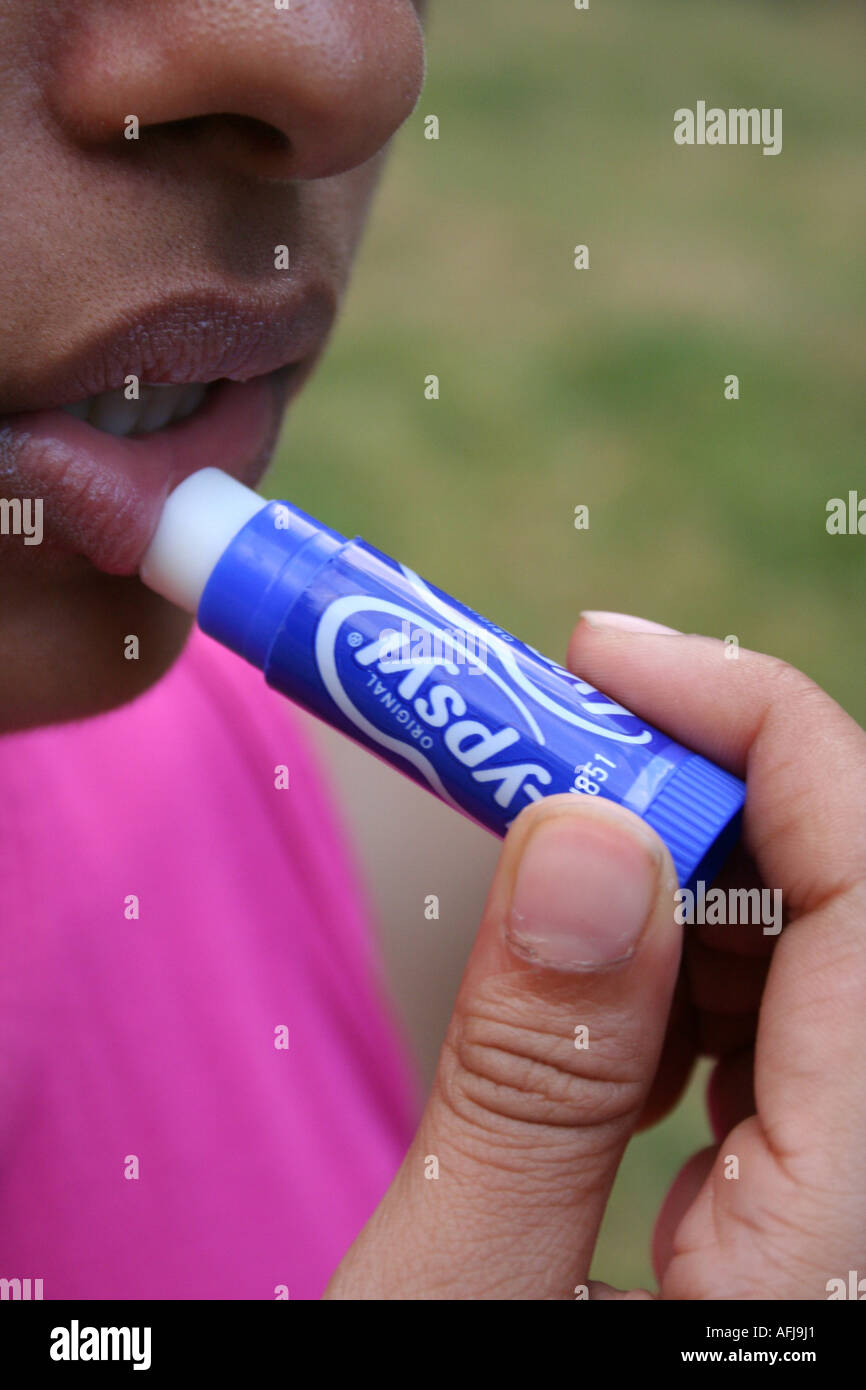 Women Using Lypsyl Lip Balm Stock Photo - Alamy