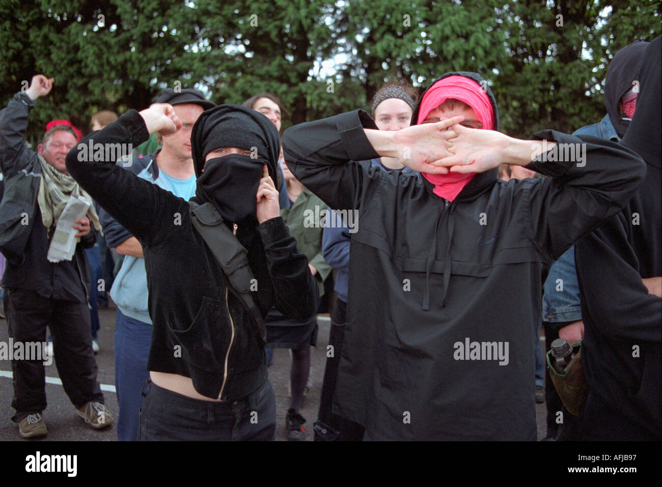 Women protesting against arms trade fair at the Excel Centre in London in front of police line up. Stock Photo