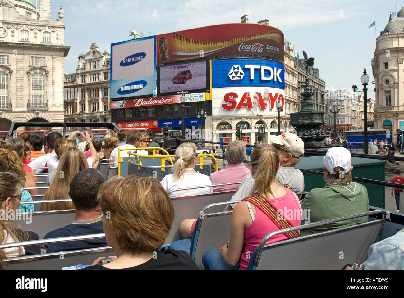 London onboard top deck of open top tour bus with tourists views