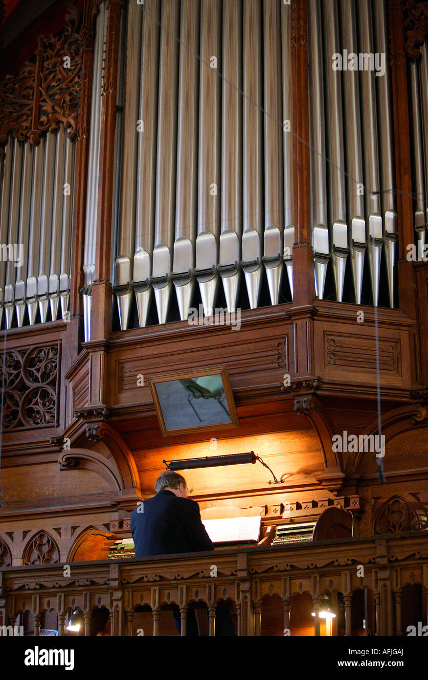 Organist in the church Thomaskirche Stock Photo