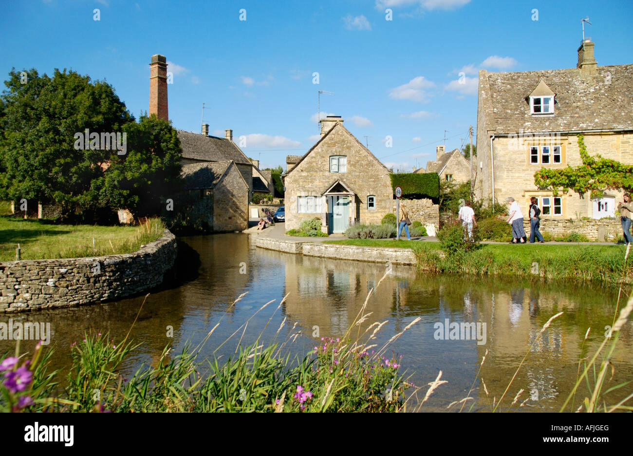Mill museum and cottages in pretty Cotswold village of Lower Slaughter Gloucestershire England UK Stock Photo