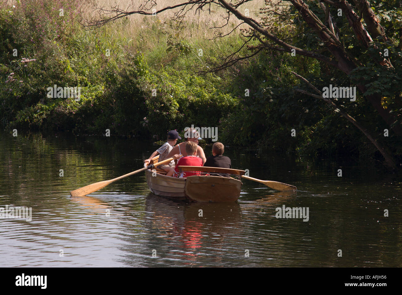 Boating on the river Stour The historic village of Dedham in Essex ...