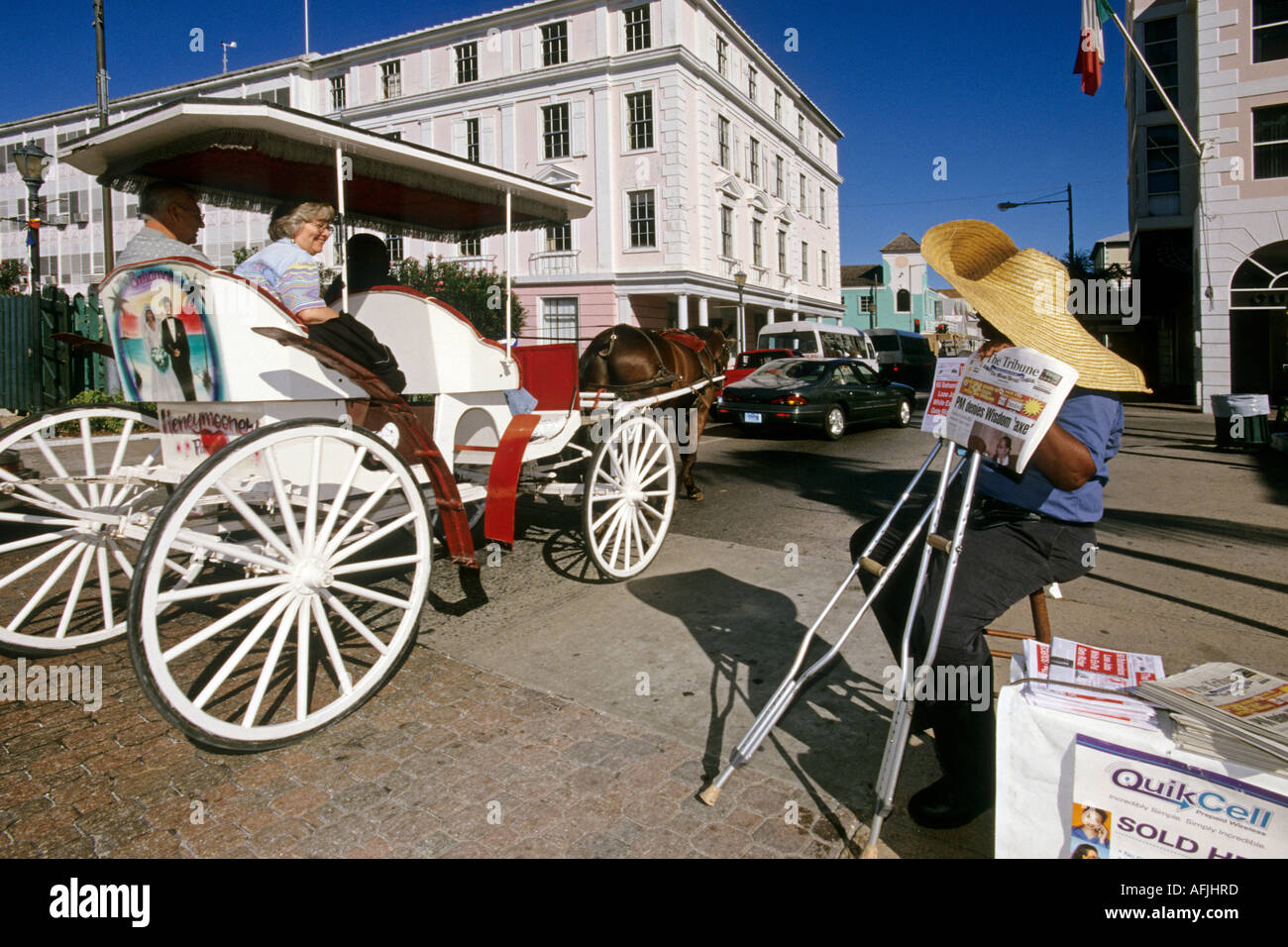 Carriage and news on Bay Street Nassau Bahamas Stock Photo