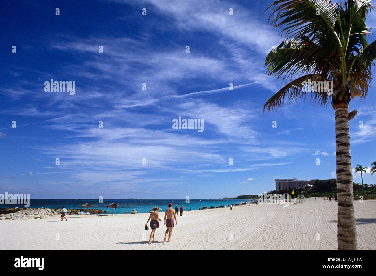 Couple walking on Cabbage Beach, Paradise Island, Nassau, Bahamas Stock