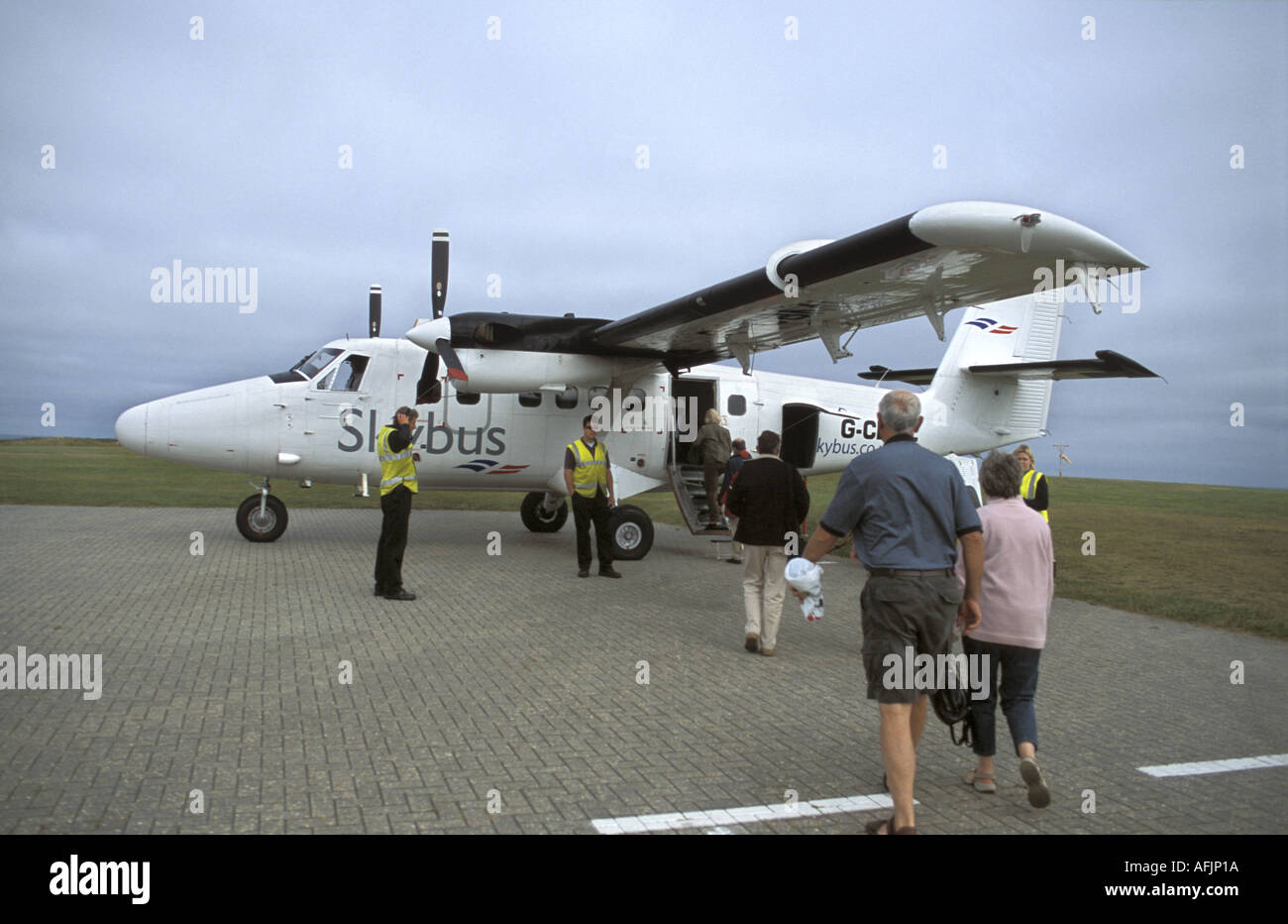 Dehavilland Twin Otter DCH 6 airplane on the runway at St Mary s airport Isles of Scilly Cornwall England Stock Photo