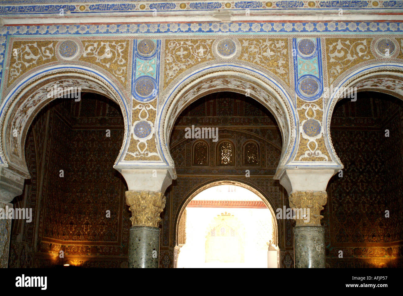 Ornate plaster arches in Alcazar former moorish fortress in Seville ...