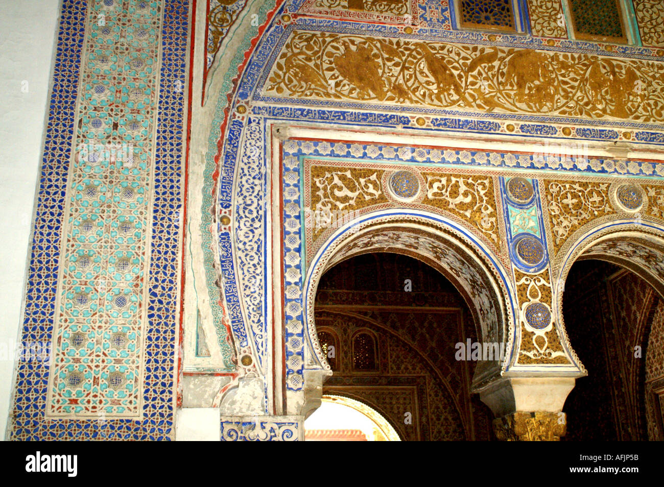 Ornate plaster arches in Alcazar former moorish fortress in Seville ...