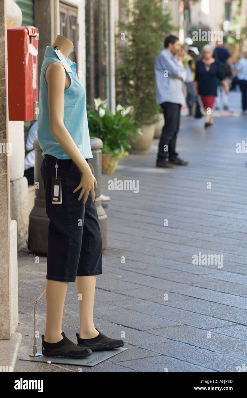 Color vertical image of a headless mannequin on a street in Taormina Italy looking as if it were walking away Stock Photo