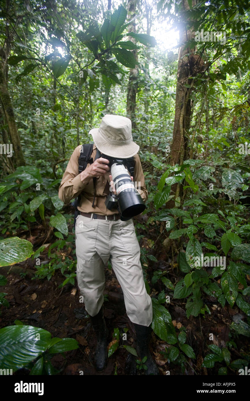 A tourist photographer in the rain forest near the Pastasa River in south east Ecuador South America Stock Photo