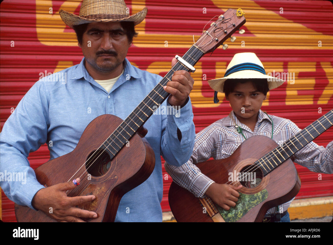 Mexico,Mexican,Central America,Pan,North Hispanic Mestizo,Quintana Roo Chetumal,traveling troubadours,father,parent parents,parent,& son play for tips Stock Photo