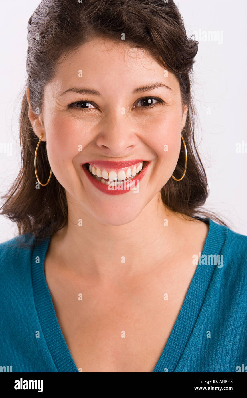Studio portrait of young woman looking at camera Stock Photo - Alamy