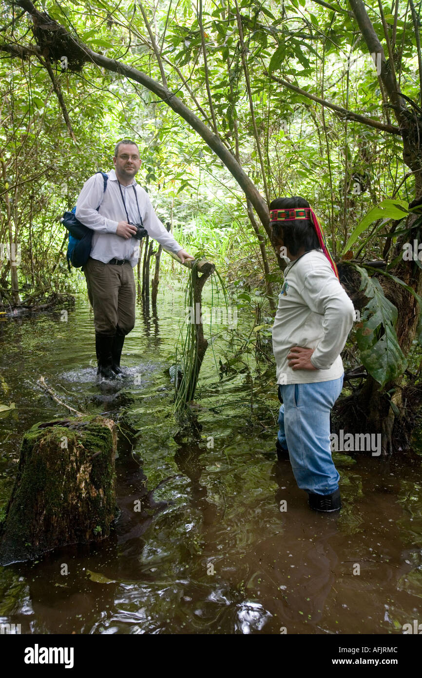 Tourists treking through the rain forest near the Pastasa River in south east Ecuador South America Stock Photo