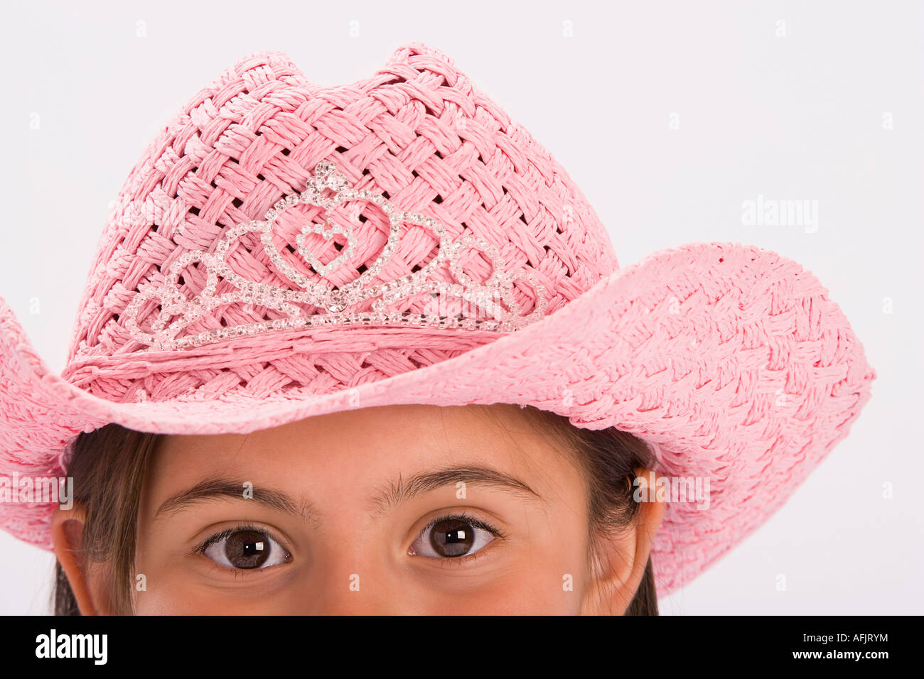 Young girl wearing pink cowgirl hat Stock Photo Alamy