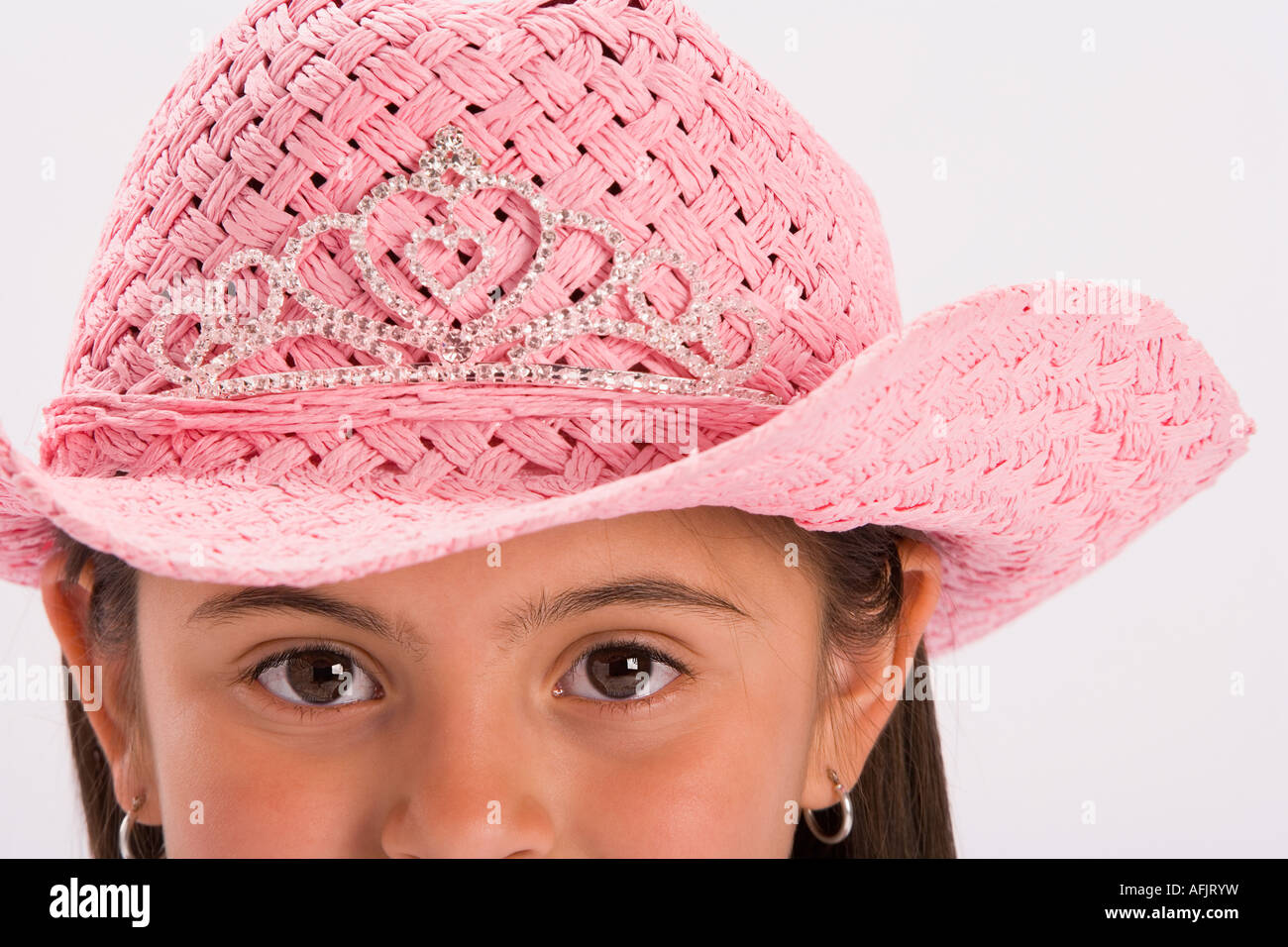 Young girl wearing pink cowgirl hat Stock Photo - Alamy