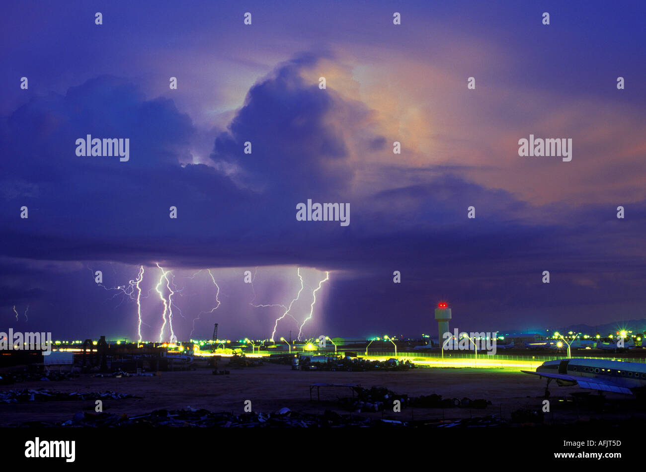 Lightning strikes over the Airplane Graveyard at Davis Monthan Airforce Base in Tucson, Arizona, USA. Stock Photo