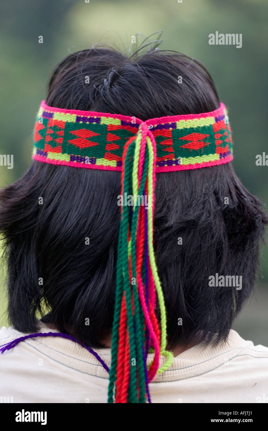 Achuar Guide wearing decorative head band in rain forest near the Pastasa River in south east Ecuador South America Stock Photo