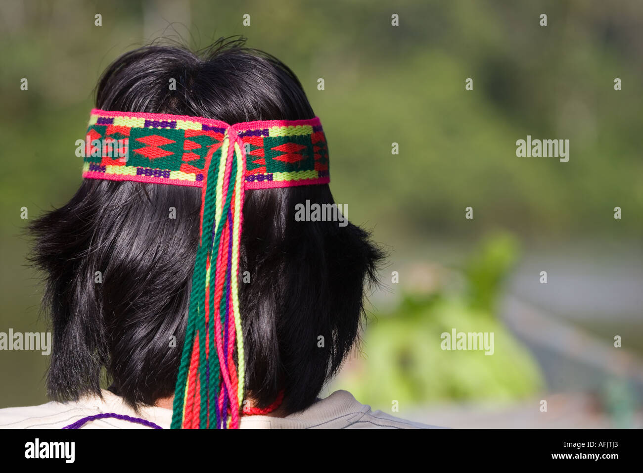 Achuar Guide wearing decorative head band in rain forest near the Pastasa River in south east Ecuador South America Stock Photo