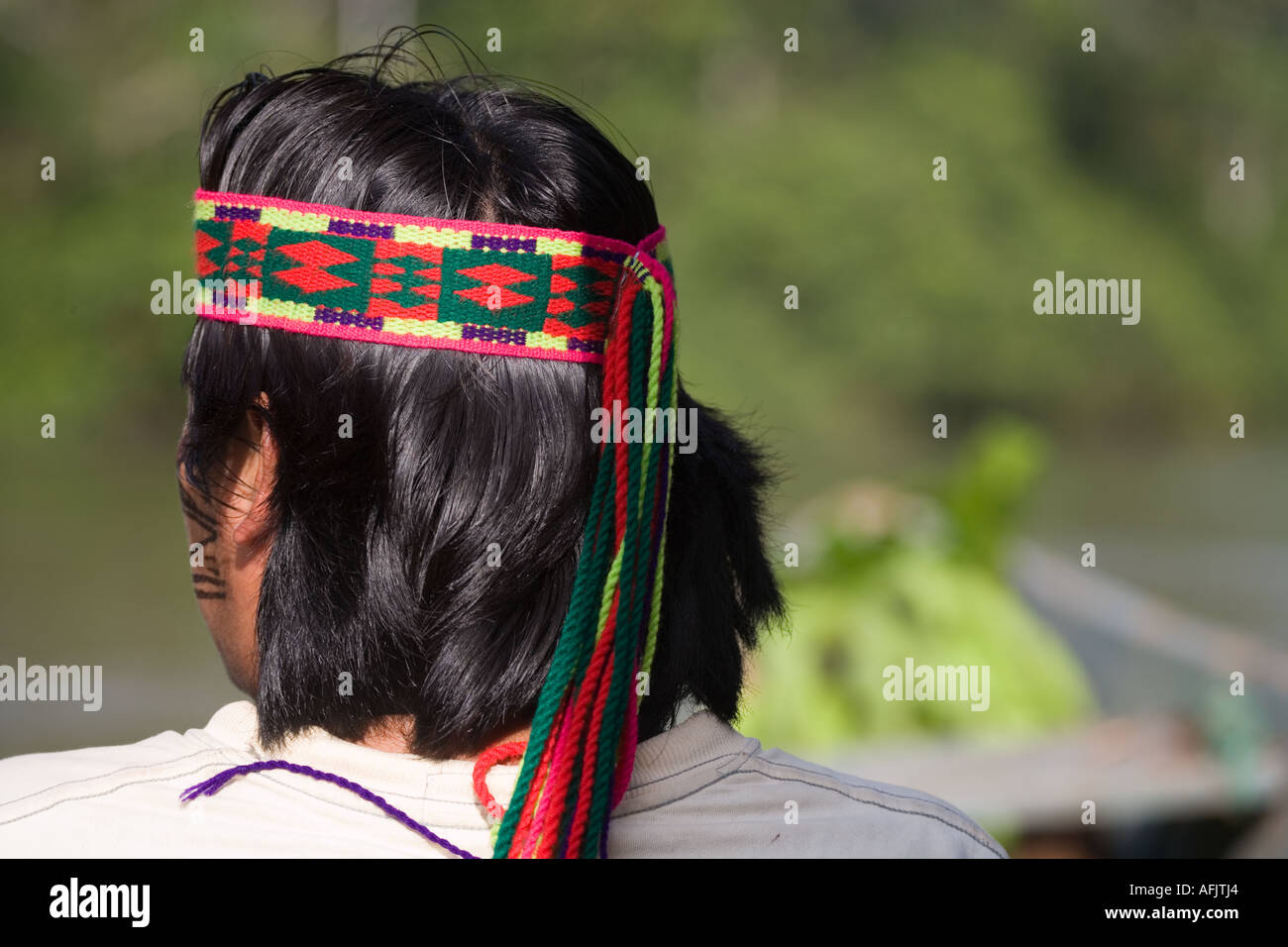 Achuar Guide wearing decorative head band in rain forest near the Pastasa River in south east Ecuador South America Stock Photo