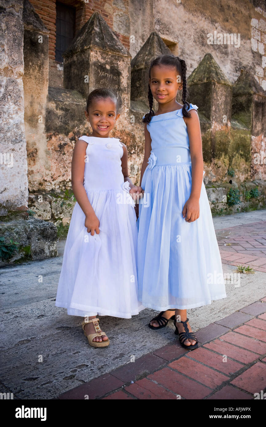 Portrait of two girls smiling and standing together Stock Photo - Alamy