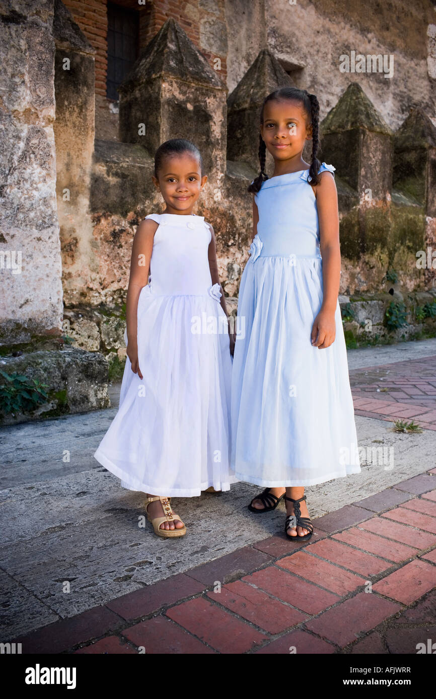 Portrait of two girls smiling and standing together Stock Photo - Alamy