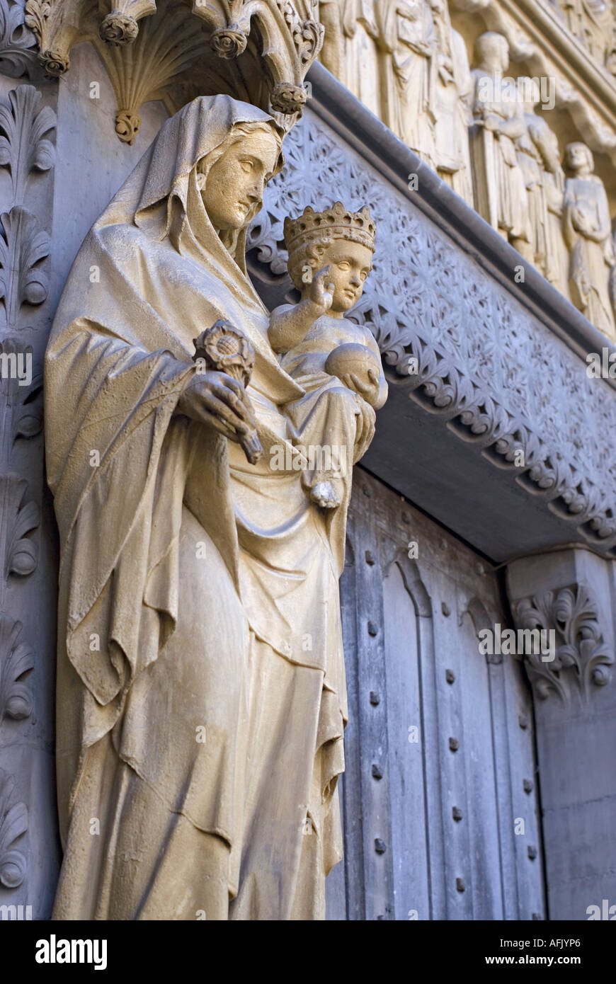 Westminster Abbey London England Ornately decorated facade Statue of