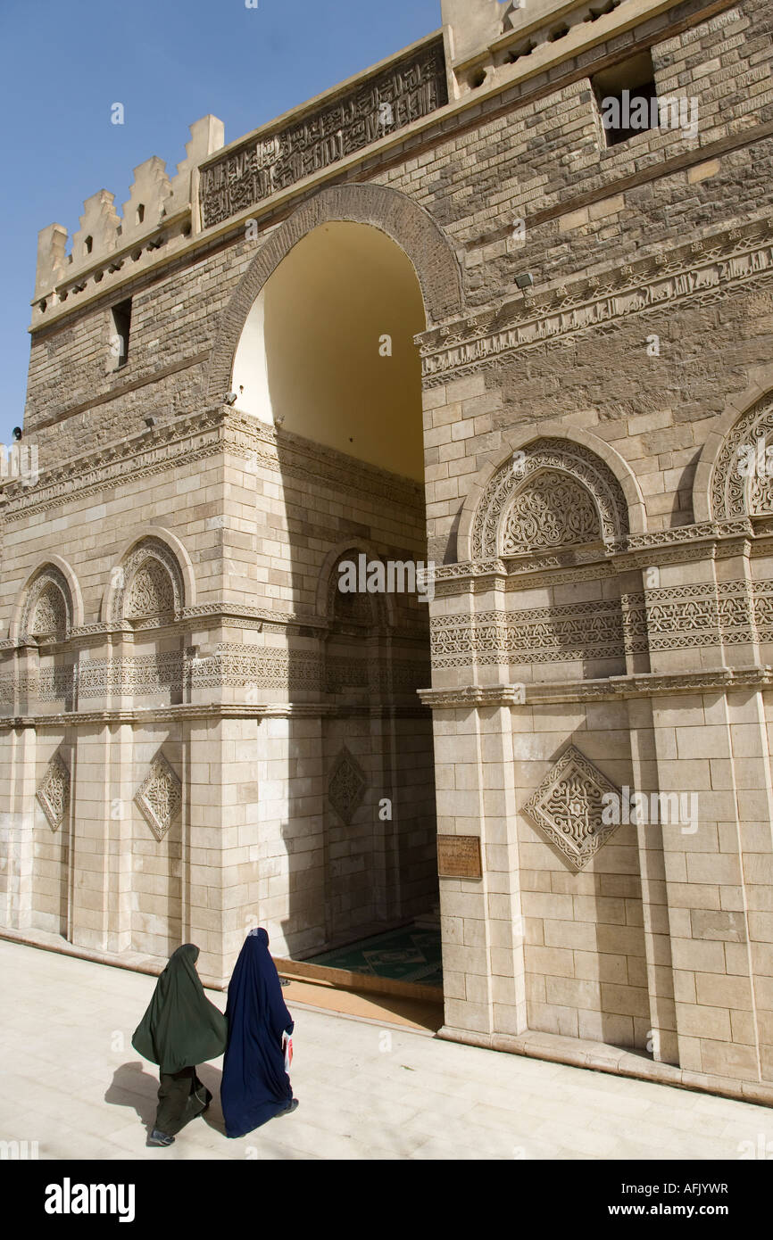 Two muslim women enter the AlHakim Mosque in Islamic Cairo, Egypt