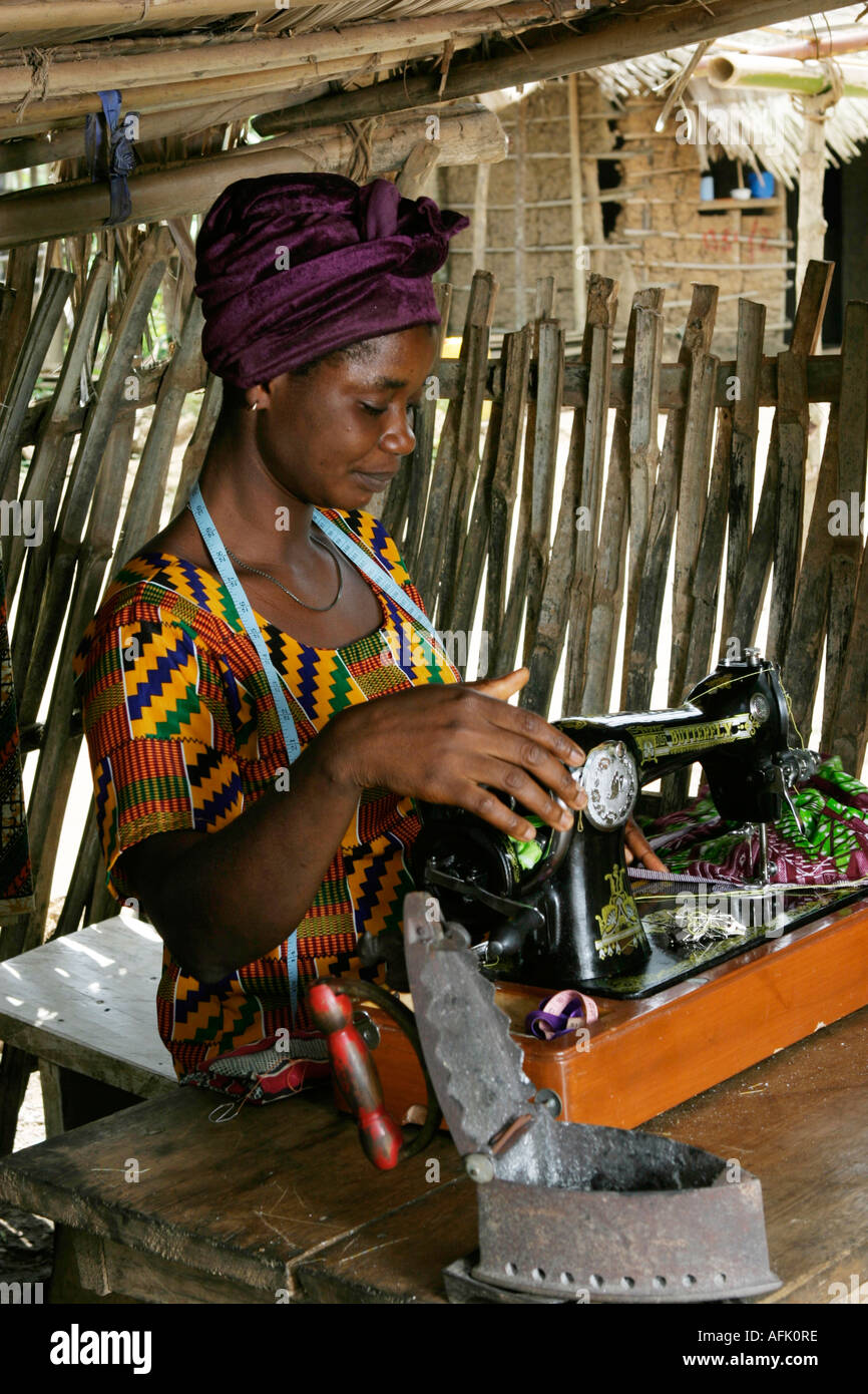 Ghanaian Woman Seamstress Using Hand Operated Sewing