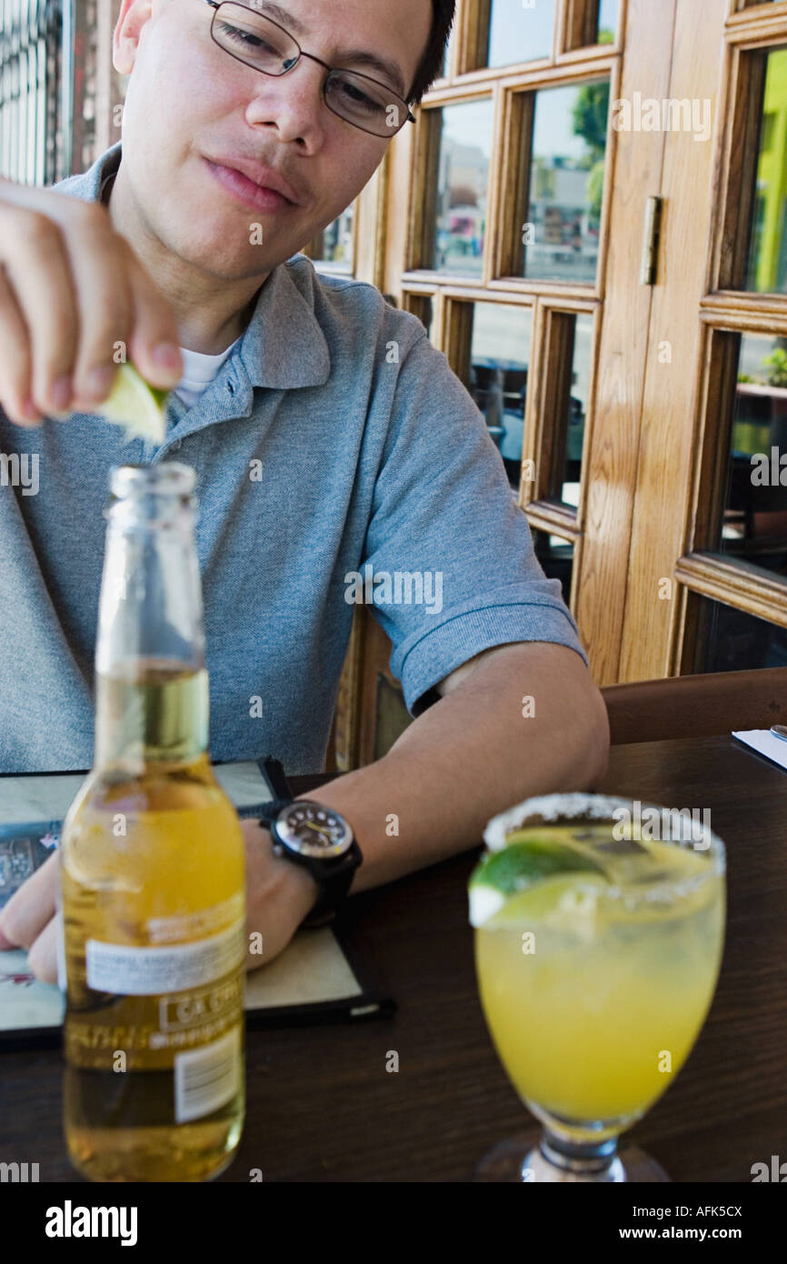 Man drinking at outdoor restaurant. Stock Photo