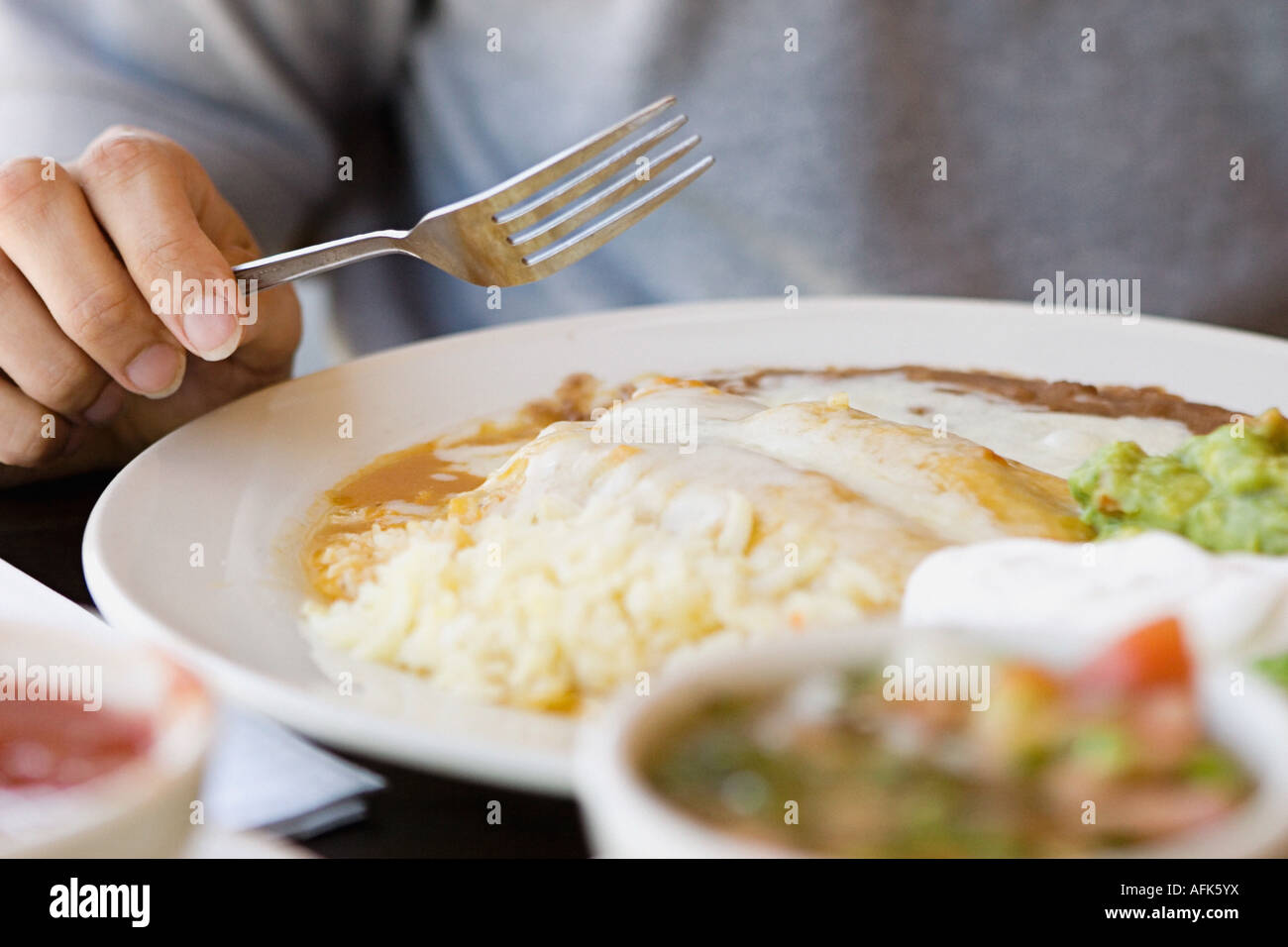 Person eating Mexican food Stock Photo