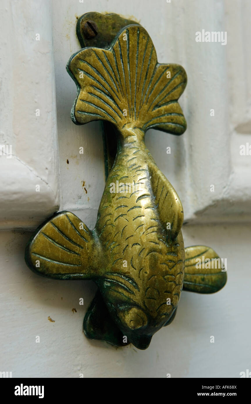 Door knocker in the shape of a fish on a cottage in the Cornish fishing