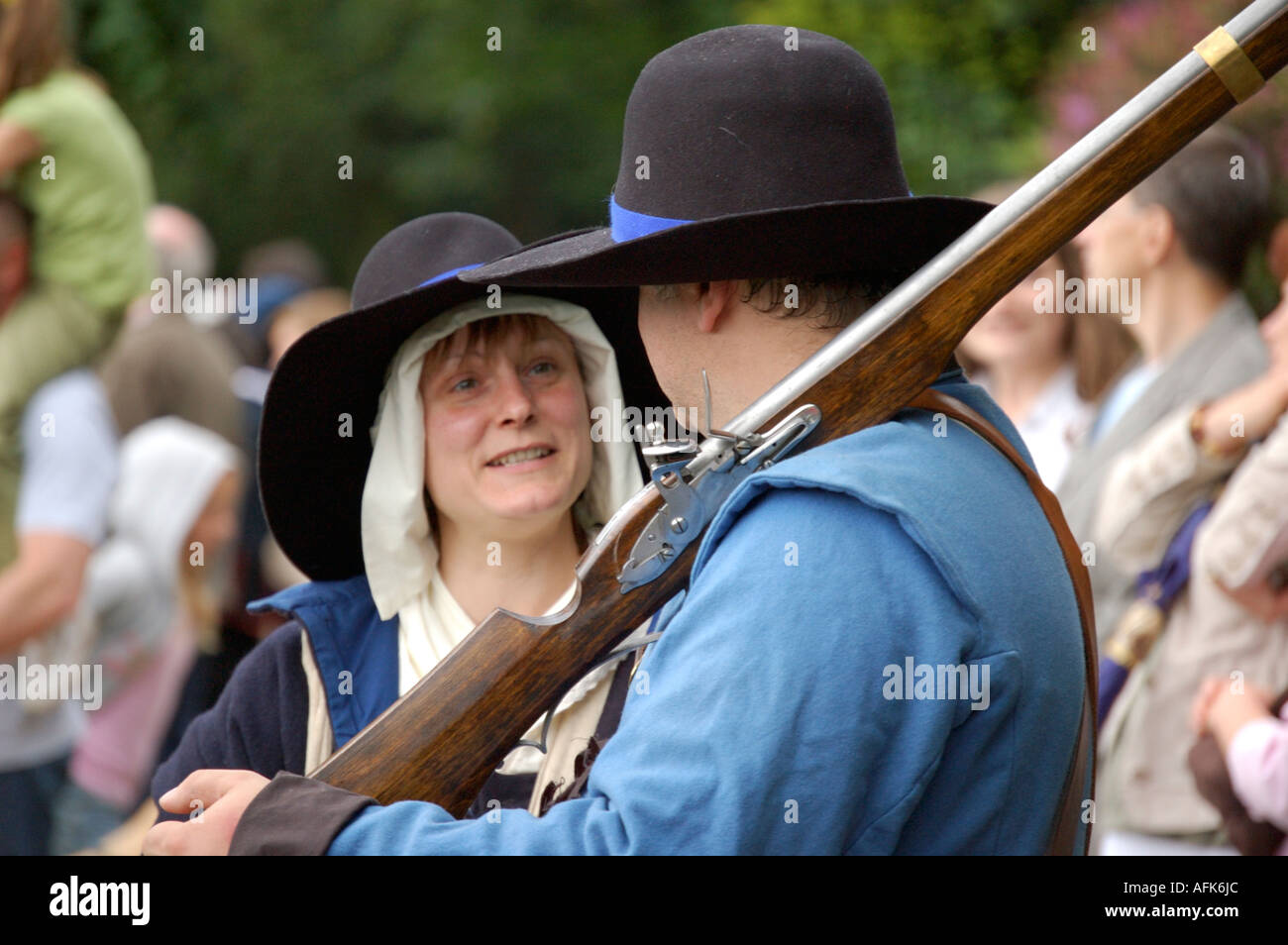 English Civil war soldier and woman in period dress at a reenactment