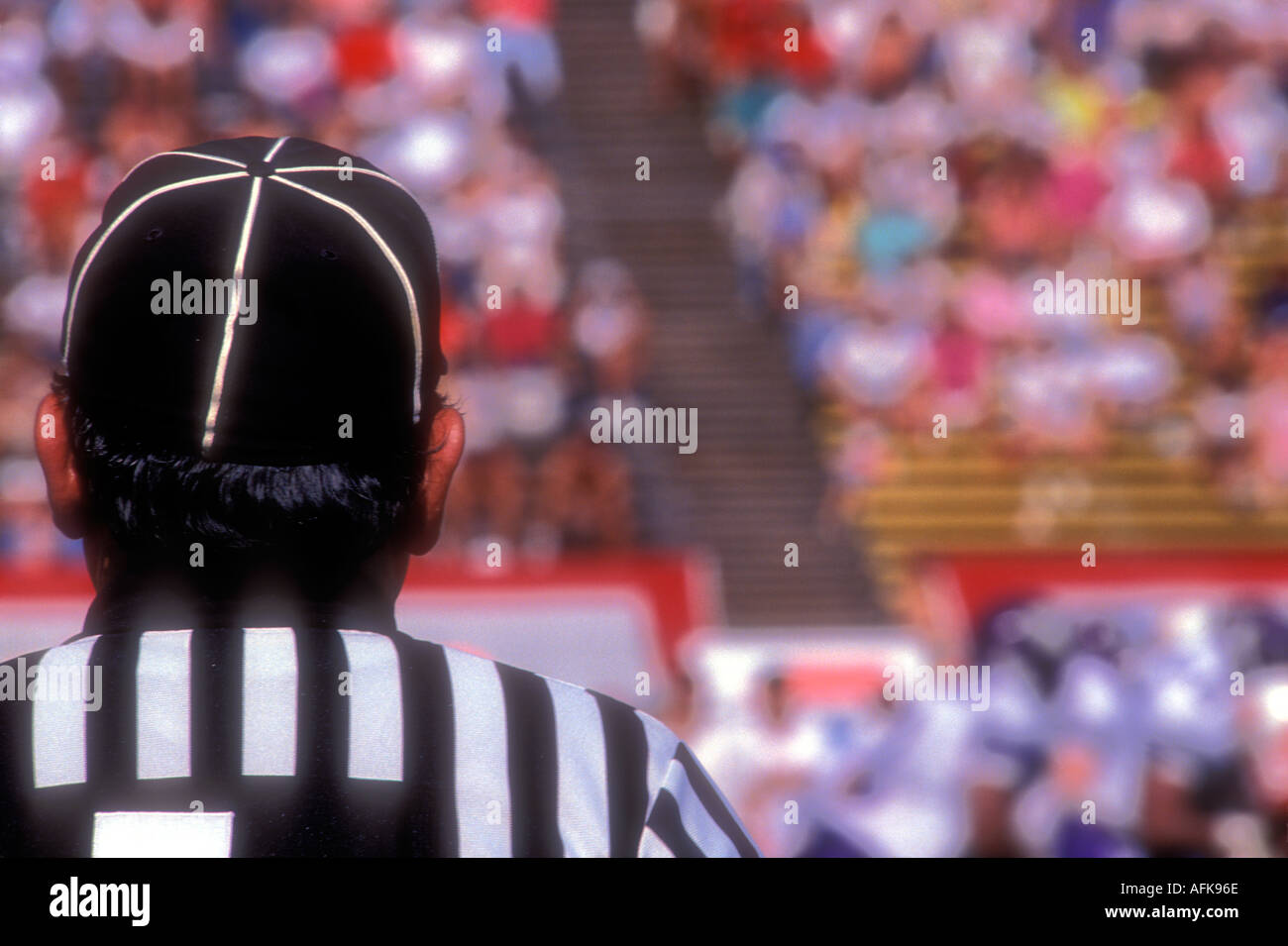 Rear view of umpires head at football game Stock Photo