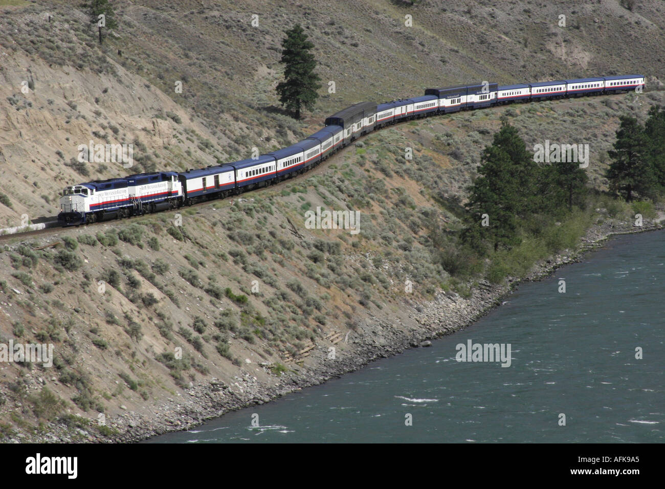 Rocky Mountaineer Railtours Train traveling by the Thompson River near Spencers Bridge in British Columbia Canada Stock Photo
