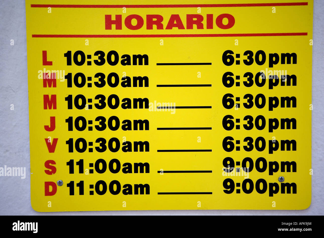 Business hours schedule sign, Spanish Stock Photo - Alamy