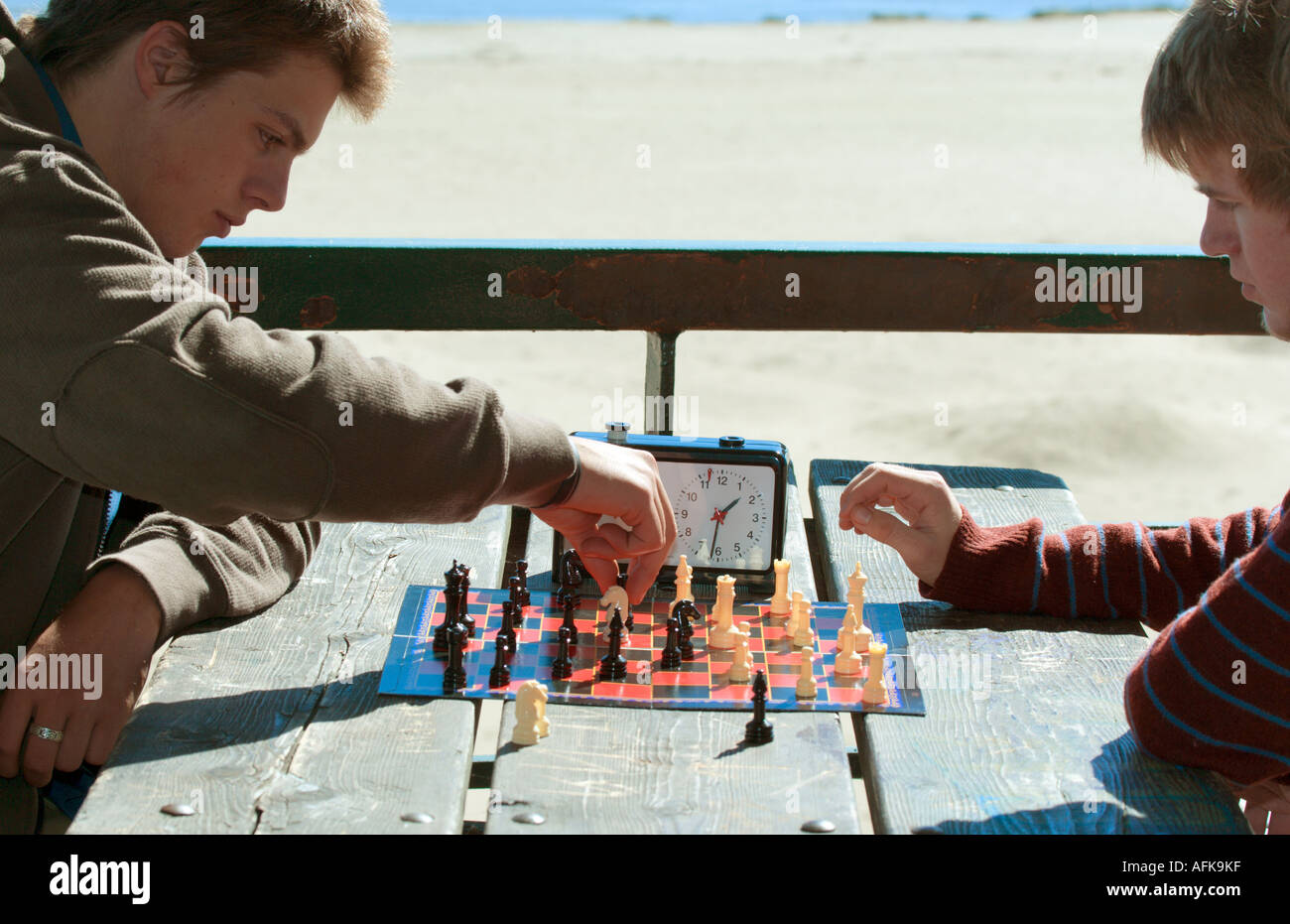 Teenage boys playing speed chess at lakefront Milwaukee Wisconsin USA Stock Photo