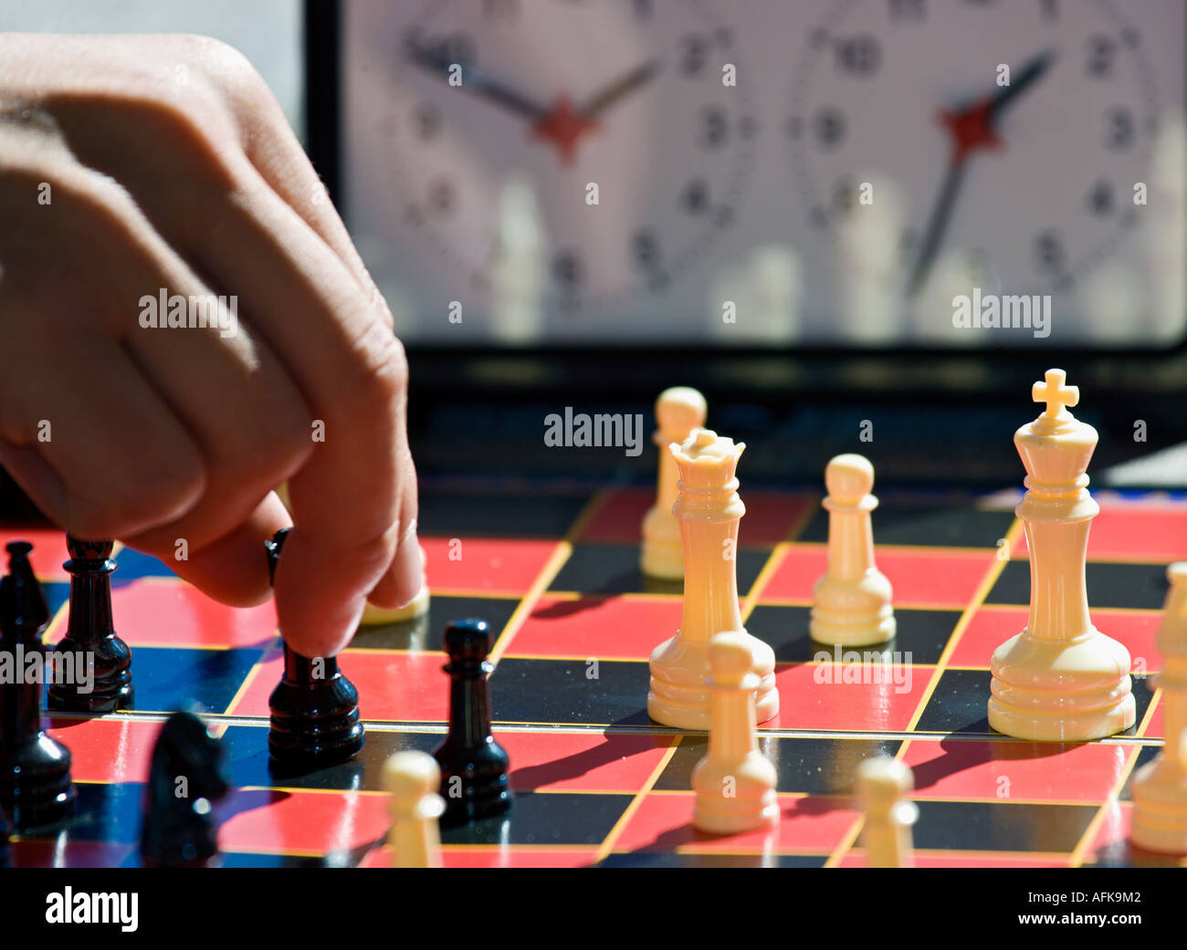 Closeup of boy's hand playing speed chess Stock Photo